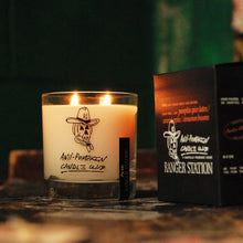 Load image into Gallery viewer, Candle with a label and a box on a dark background