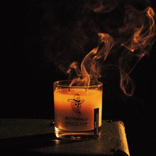 Load image into Gallery viewer, Candle with smoke rising against a dark background